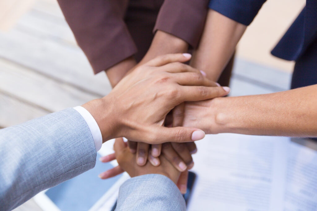 Business Team Putting Their Hands Together